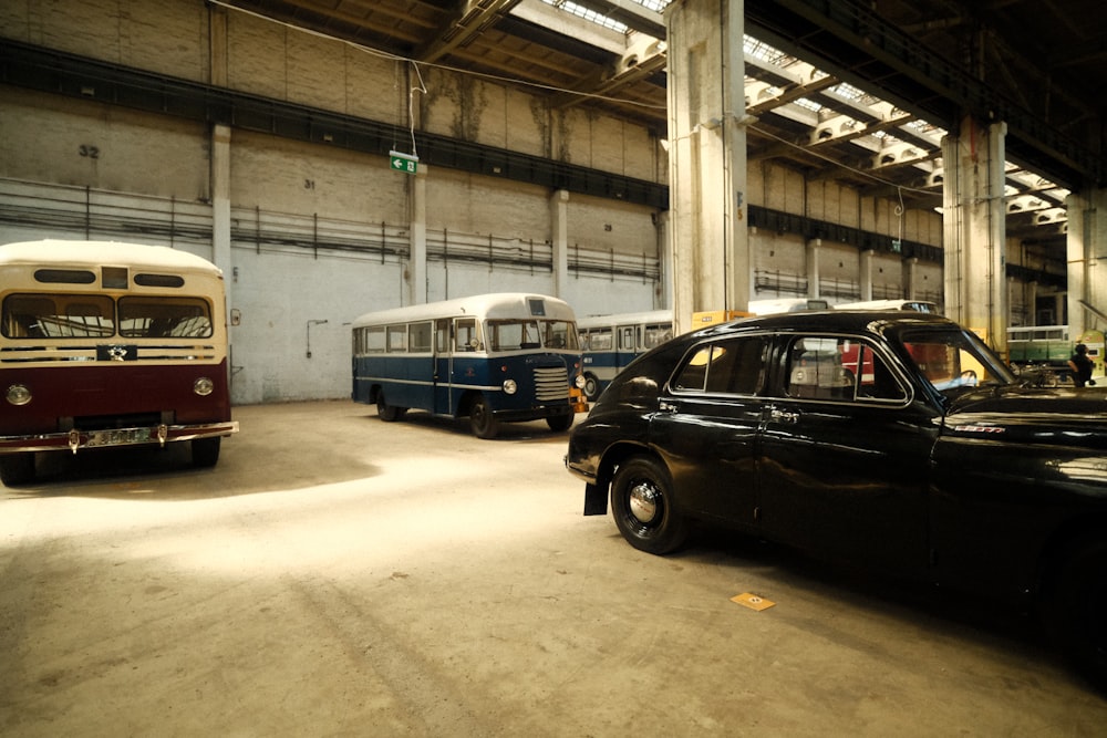 a car and a bus parked in a parking garage