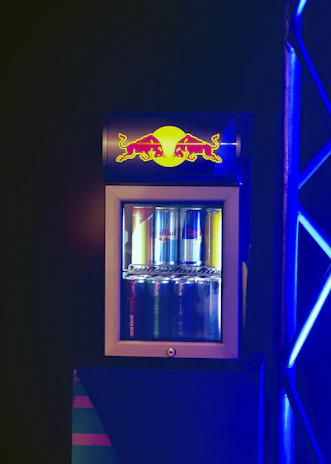 A close-up of a modern refrigerator with energy efficiency labels visible.