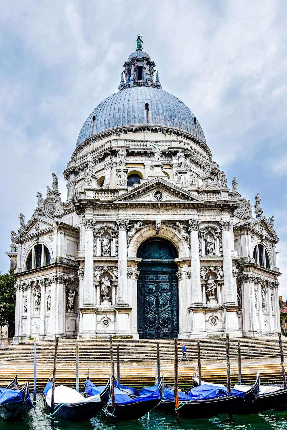 Santa Maria della Salute with a dome and boats in front of it