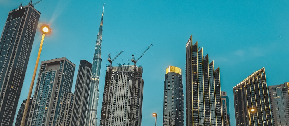 a city skyline with tall buildings