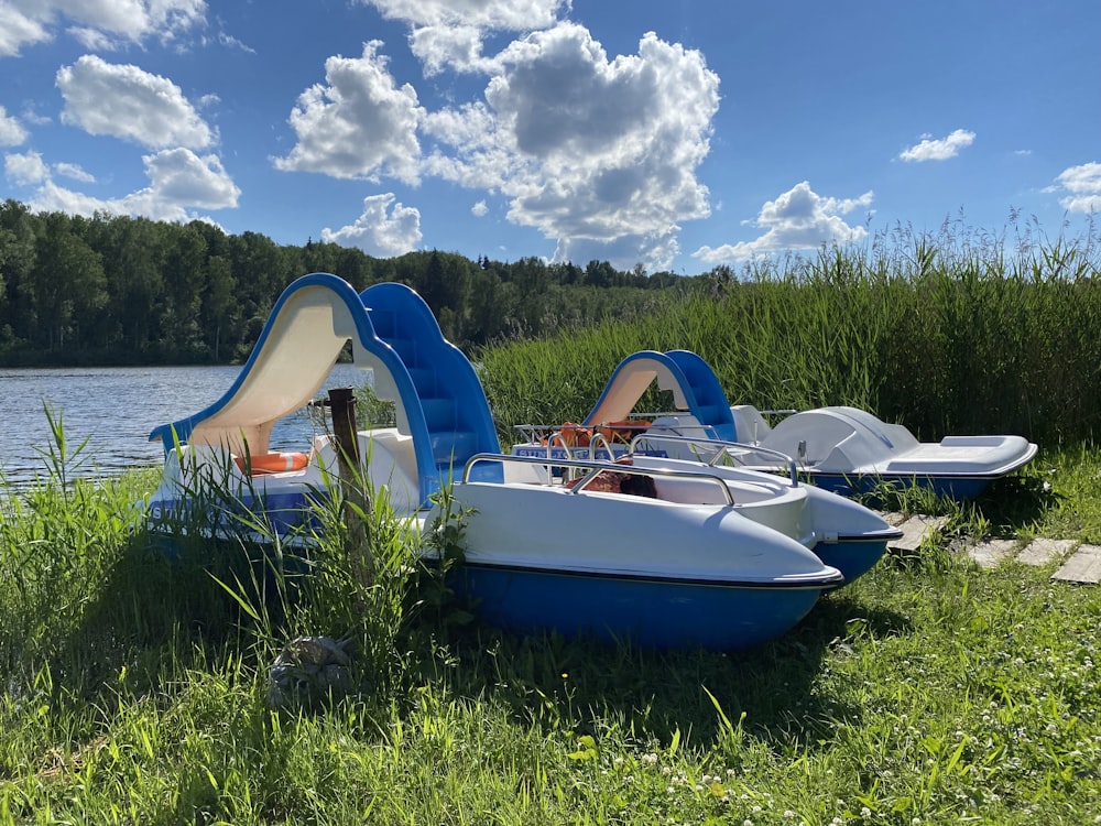 a group of boats on the grass