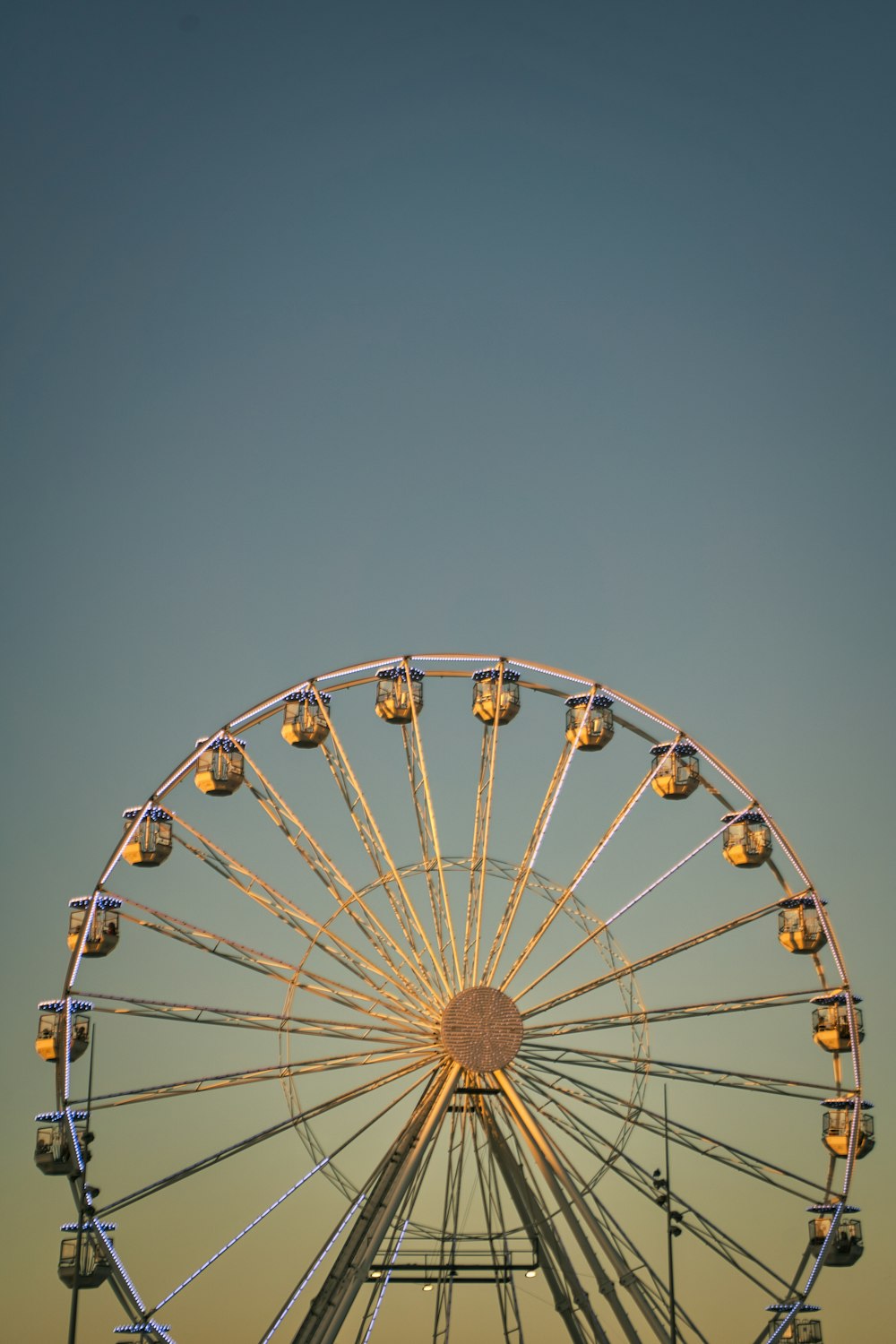 a ferris wheel against a blue sky