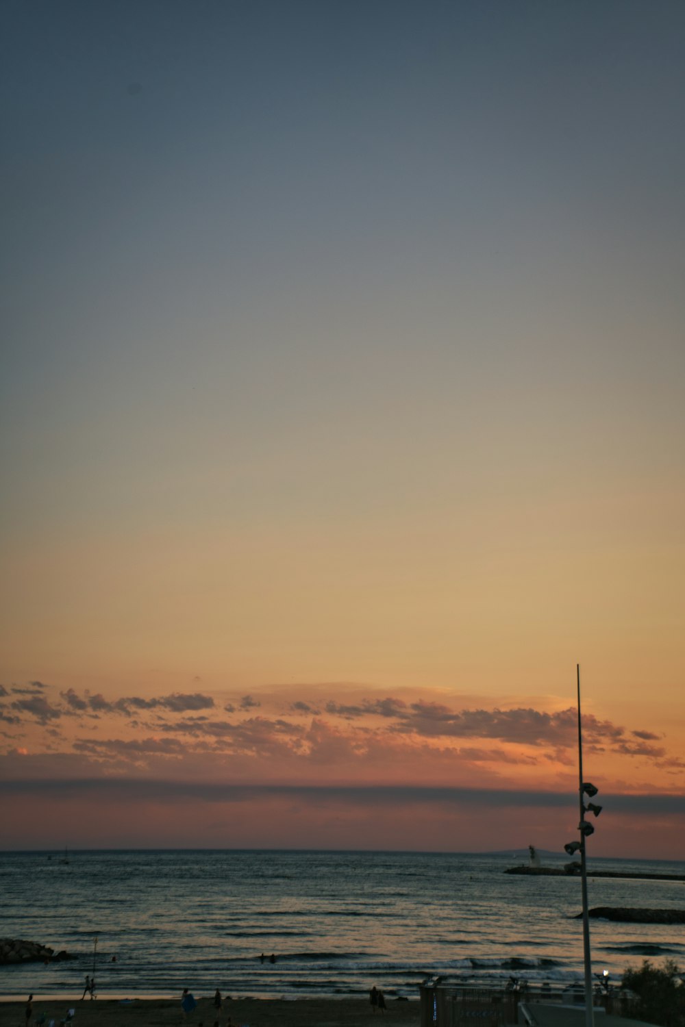 a beach with a boat in the water