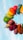A vibrant arrangement of colorful, tightly packed balloons forming a semi-circular arc against a clear blue sky, showcasing a gradient transition from one balloon color to another.