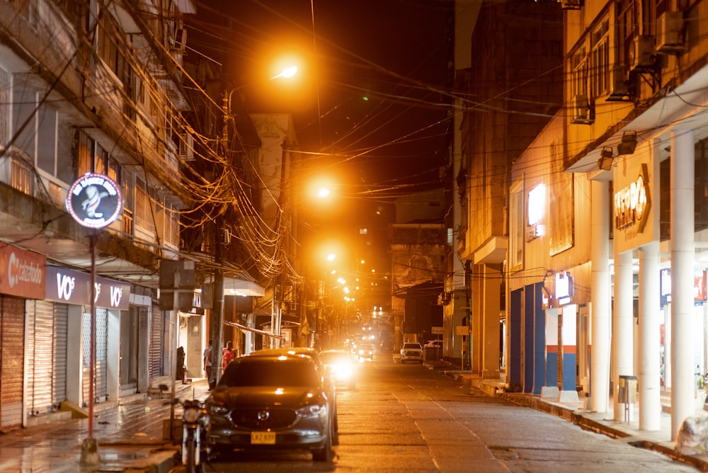 a street with cars on it and buildings on the side