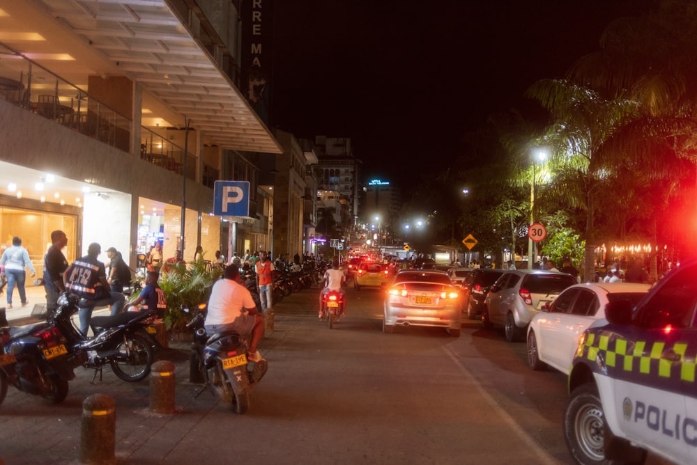 a busy street with cars and people