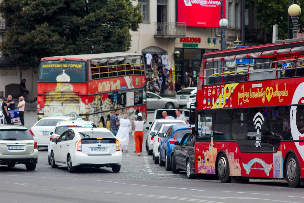 a double decker bus and cars on a busy street
