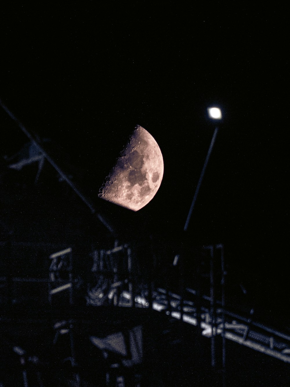 a bright moon in the night sky