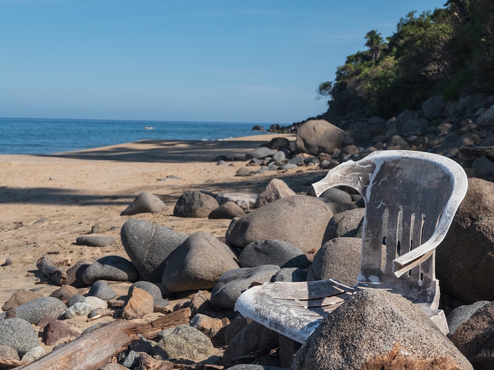 a rocky beach with a large stack of rocks