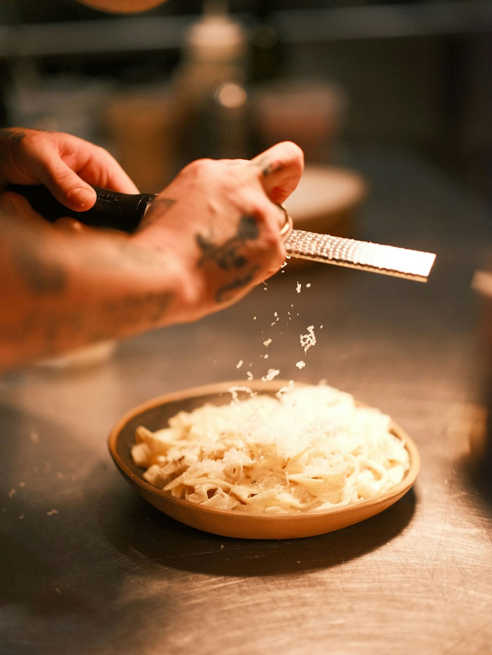 a person is cutting a bowl of rice