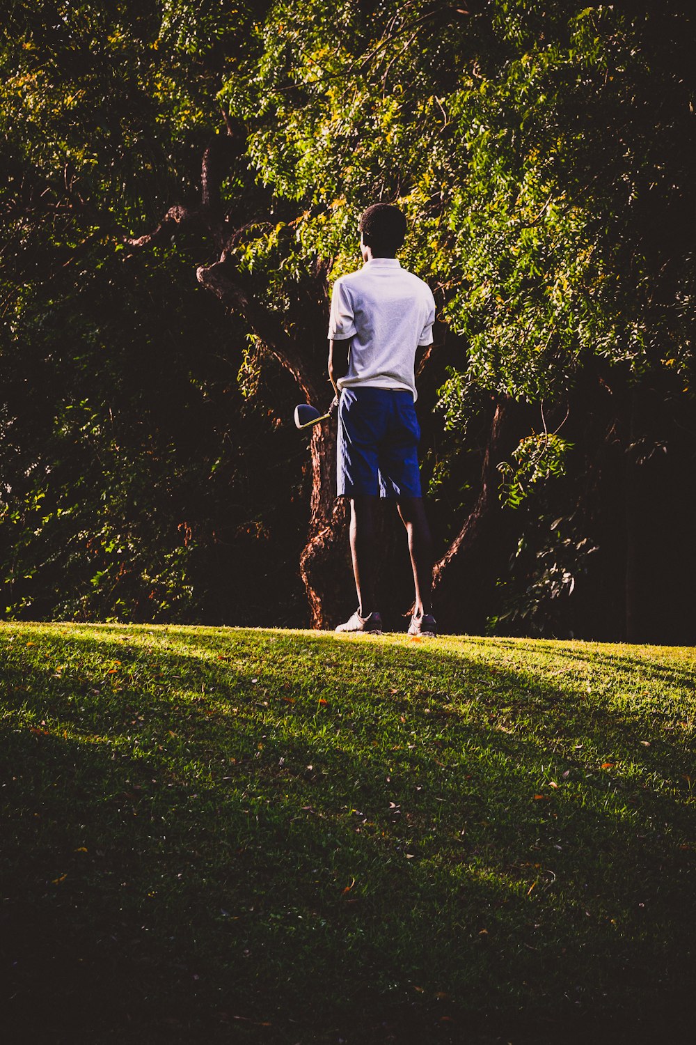 a man holding a stick