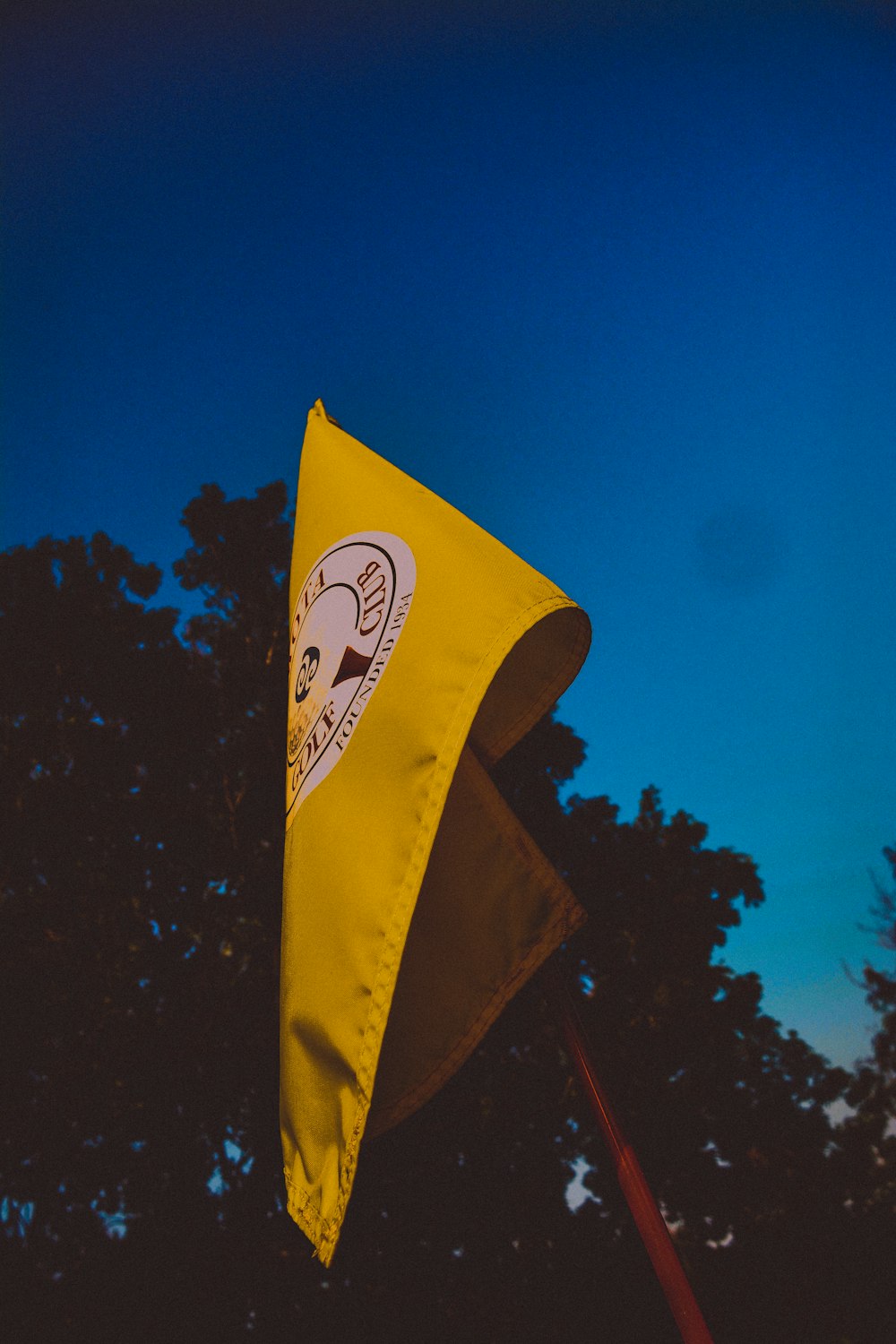 a yellow flag with a black background
