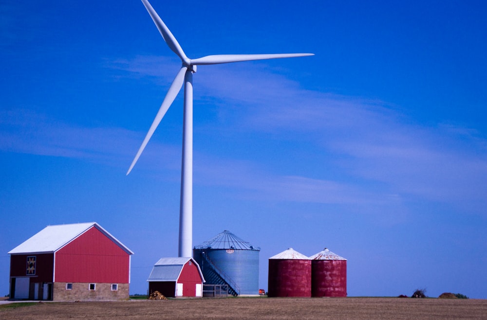 a windmill and several red buildings