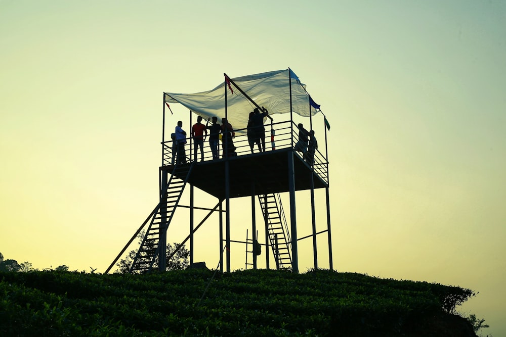 a group of people on a structure