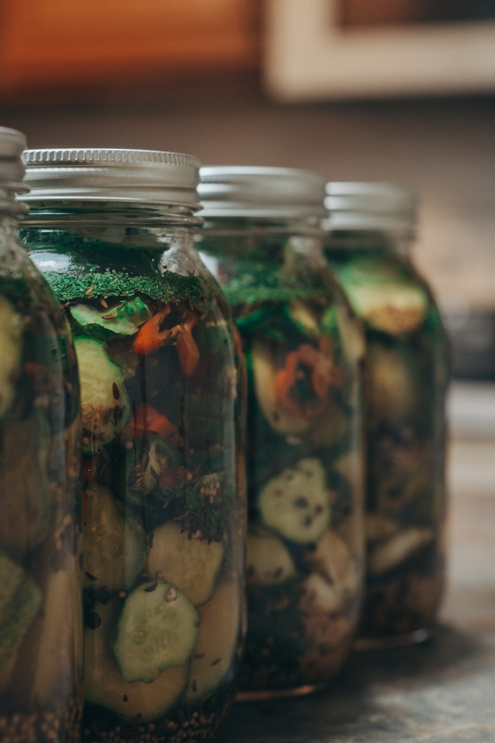 a group of fish in glass jars