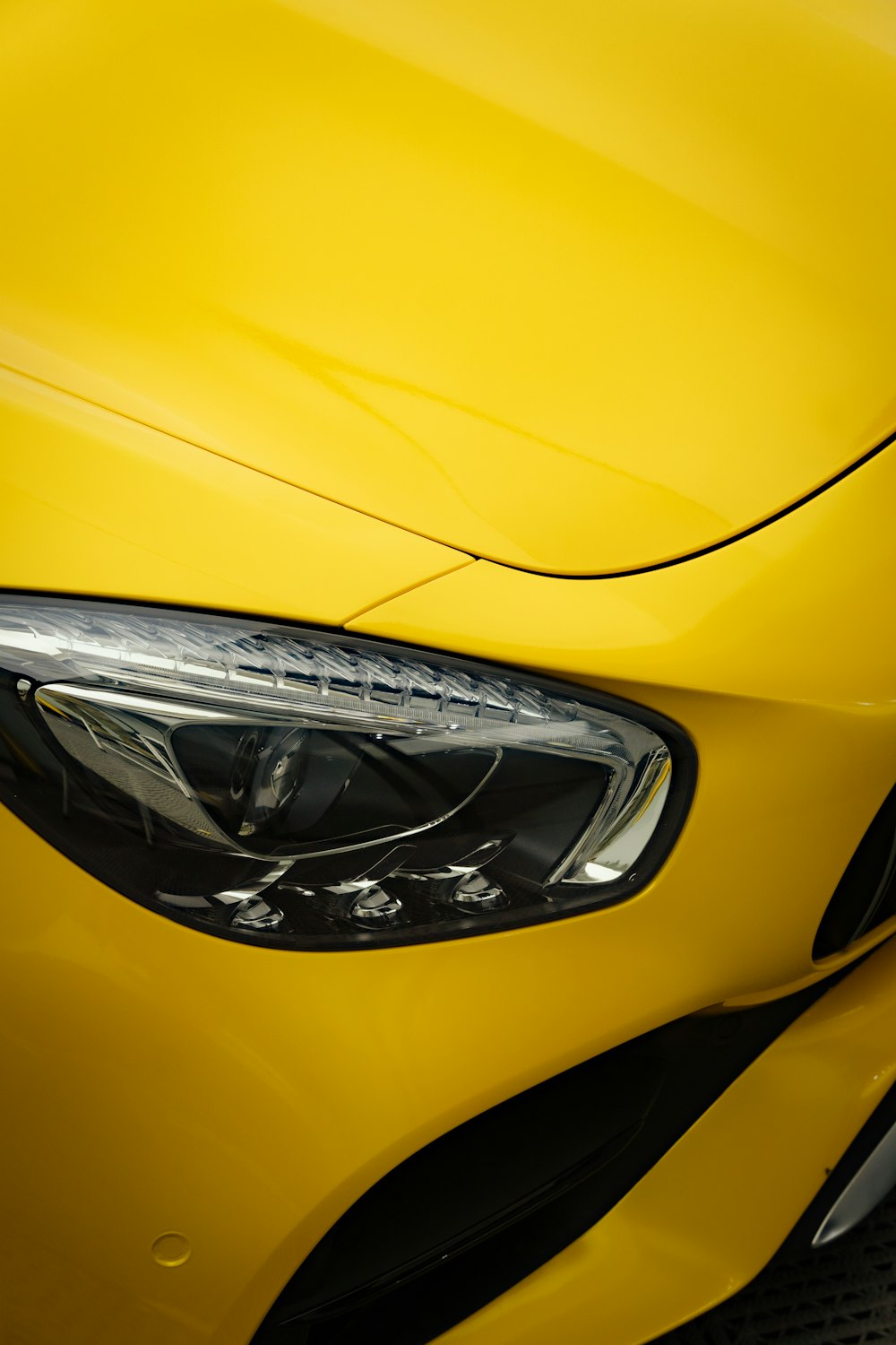 the front of a yellow car