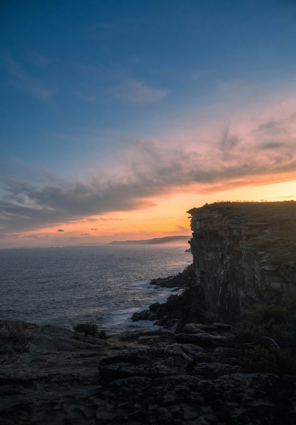 a rocky cliff overlooking the ocean