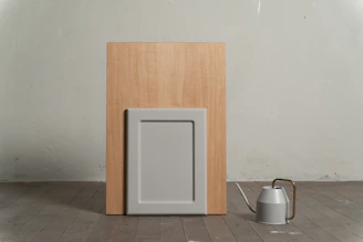 a wooden door with a metal bucket