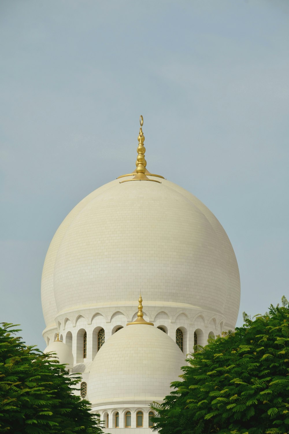 a white building with a gold top