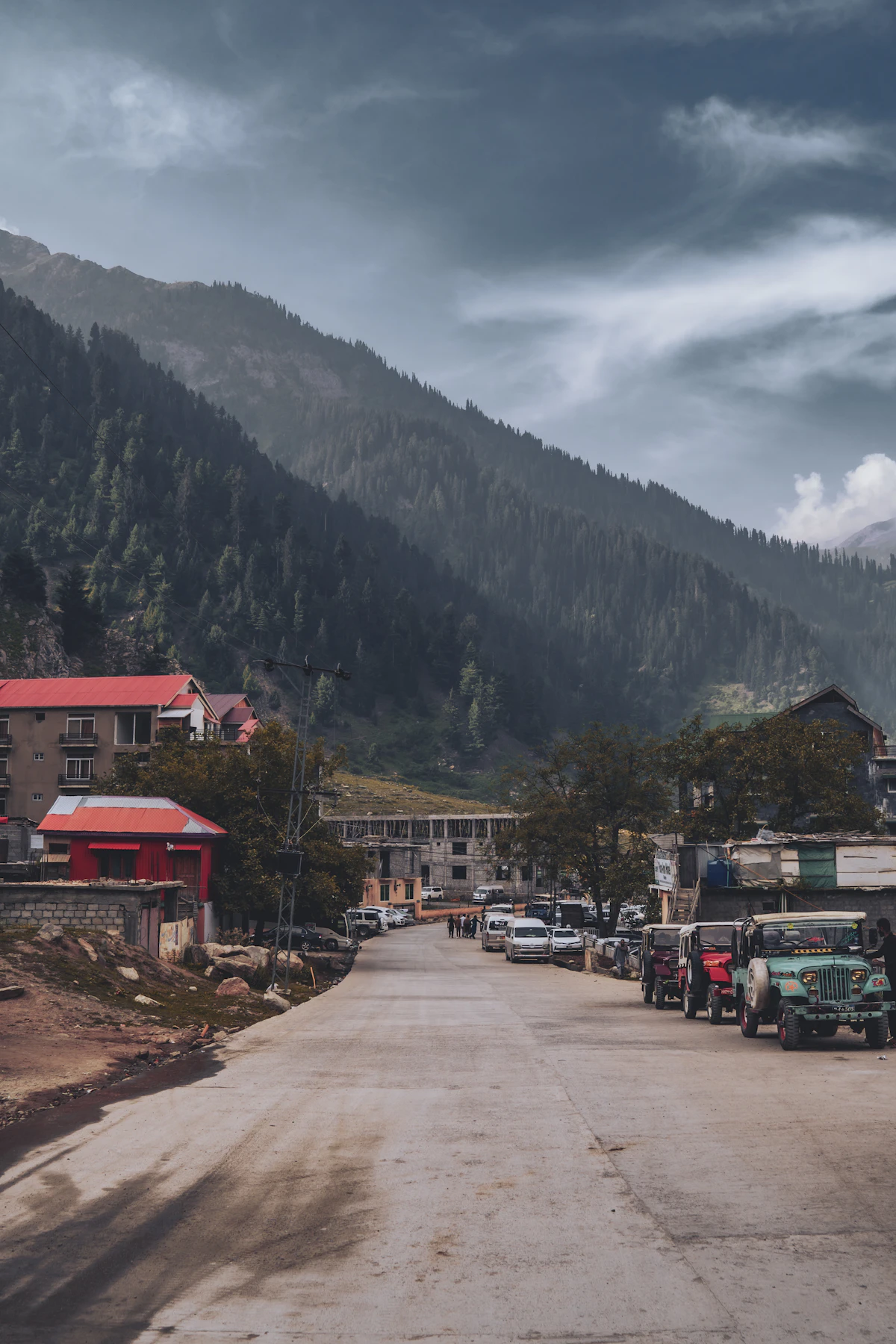 Naran town at dawn, with its main road and buildings below the mountains