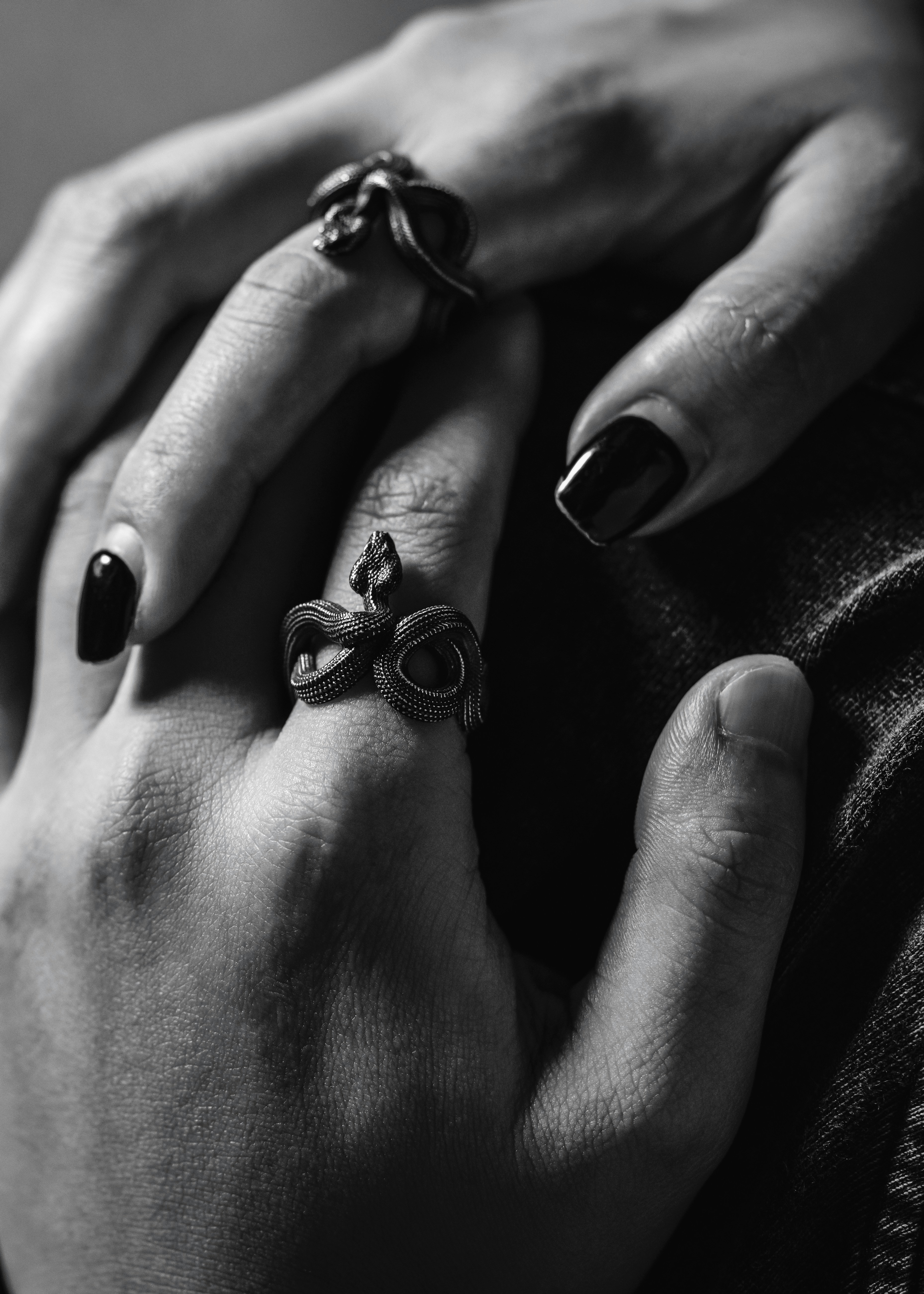 a person's hand with painted nails