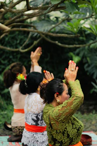 a group of women holding flowers