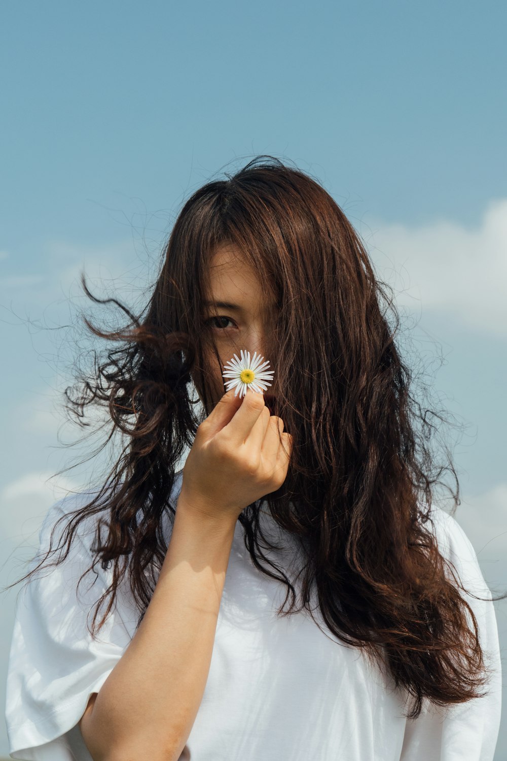 a woman with a flower in her hair