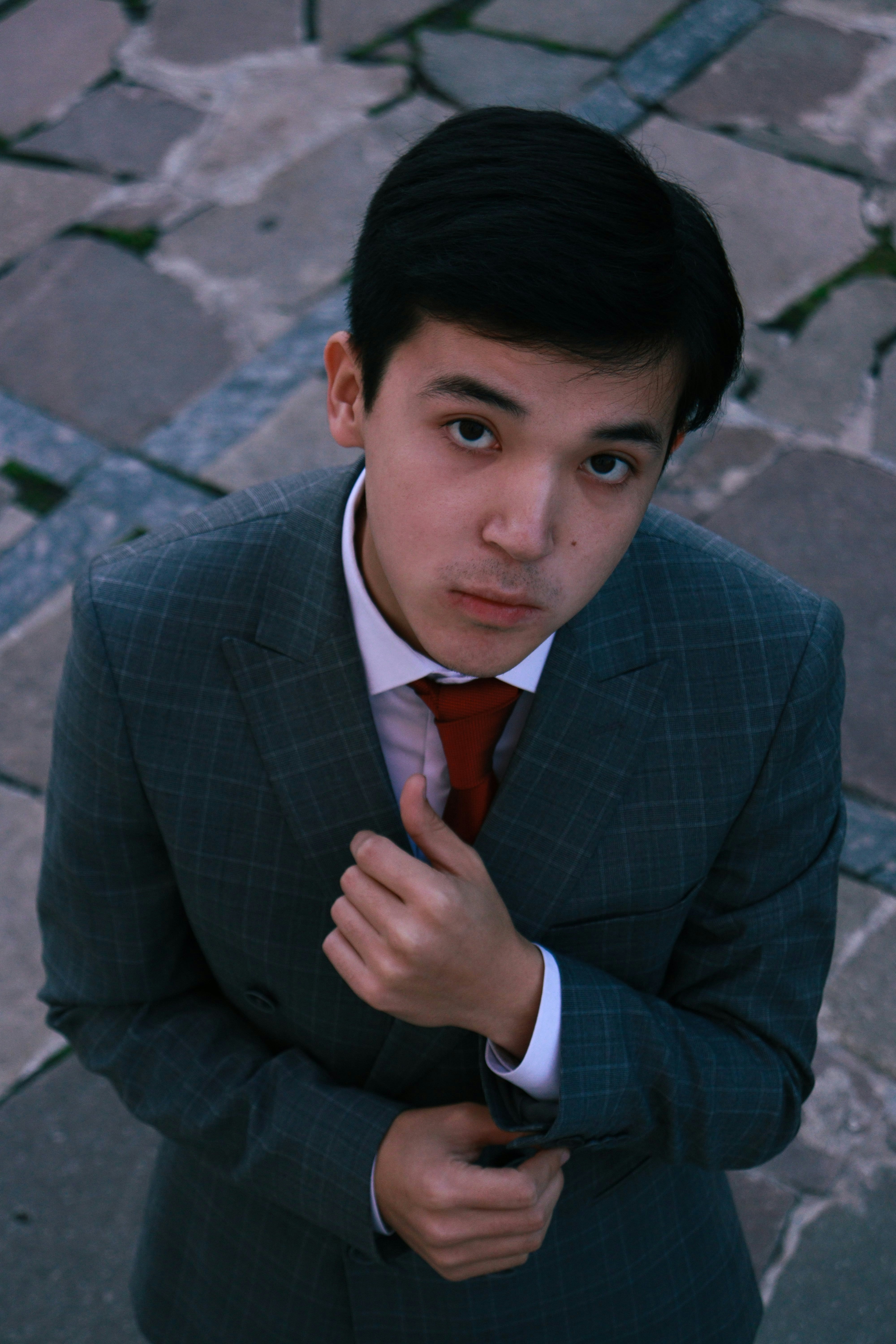 a man in a suit pointing