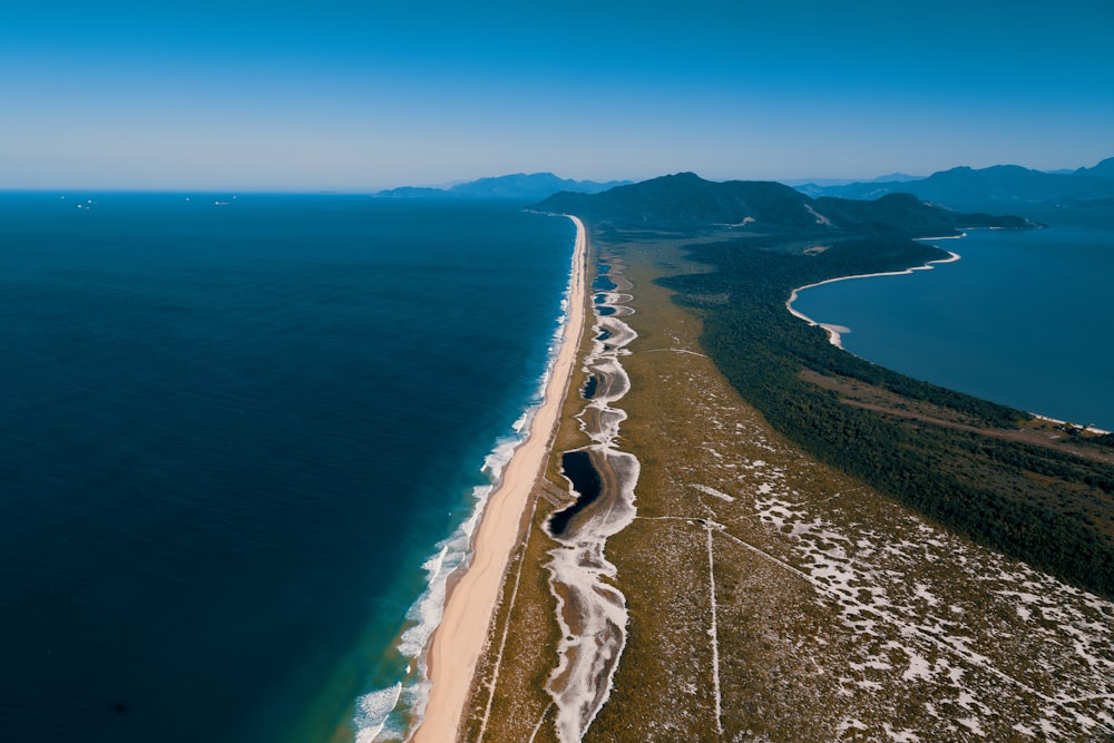 a beach with a body of water by it