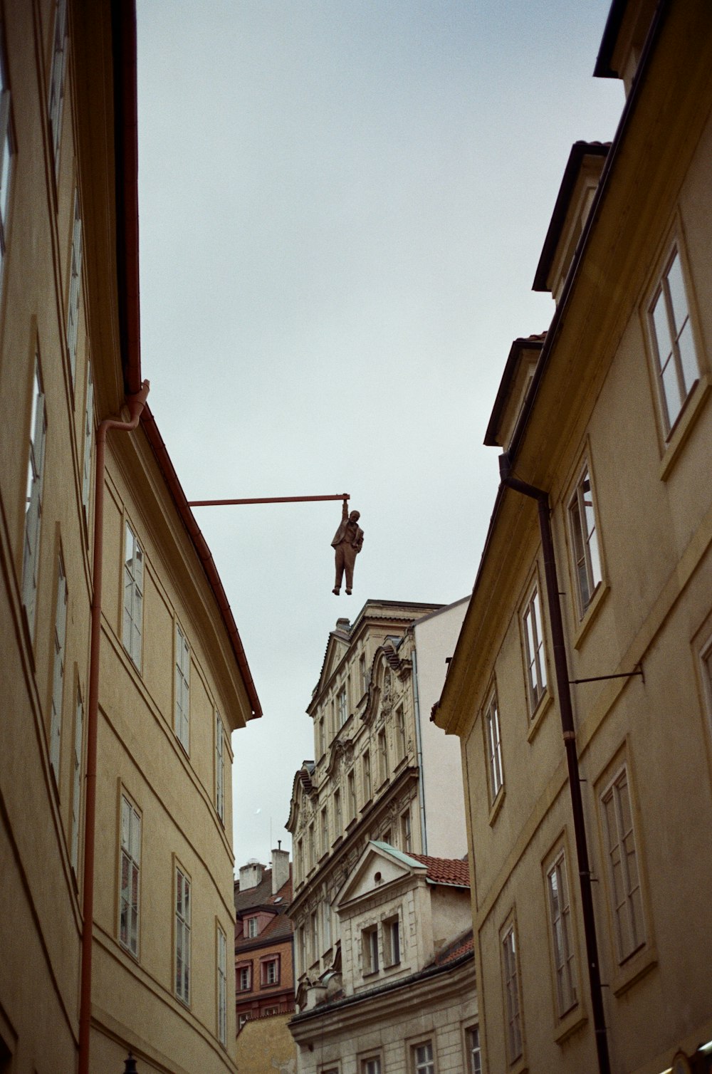 a person from a rope between buildings