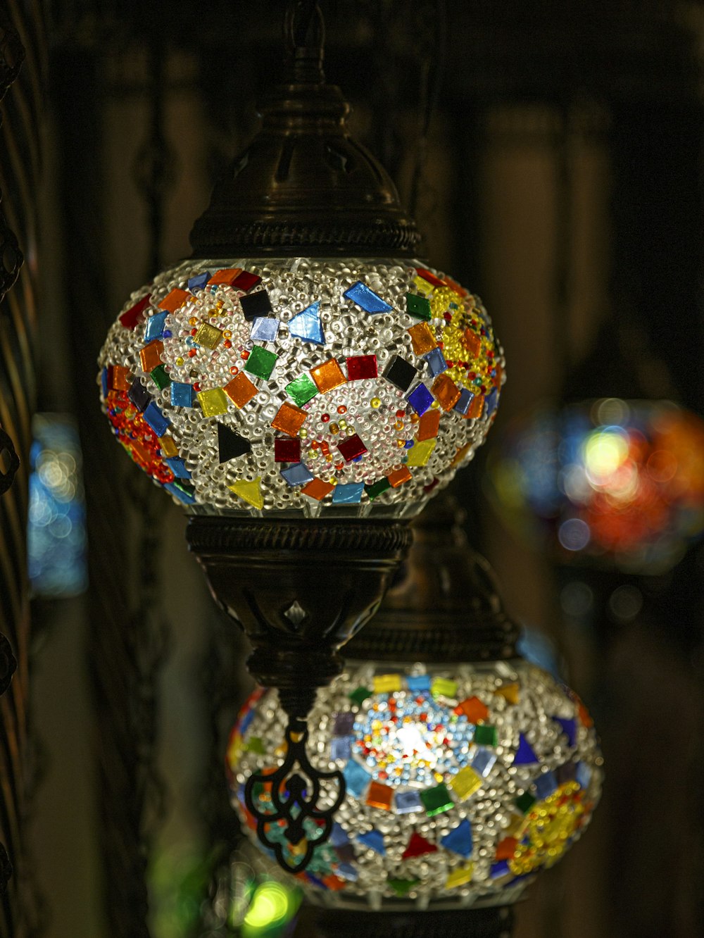 a glass lantern with colorful lights