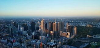 Overview of a city skyline at sunset, highlighting potential investment areas.