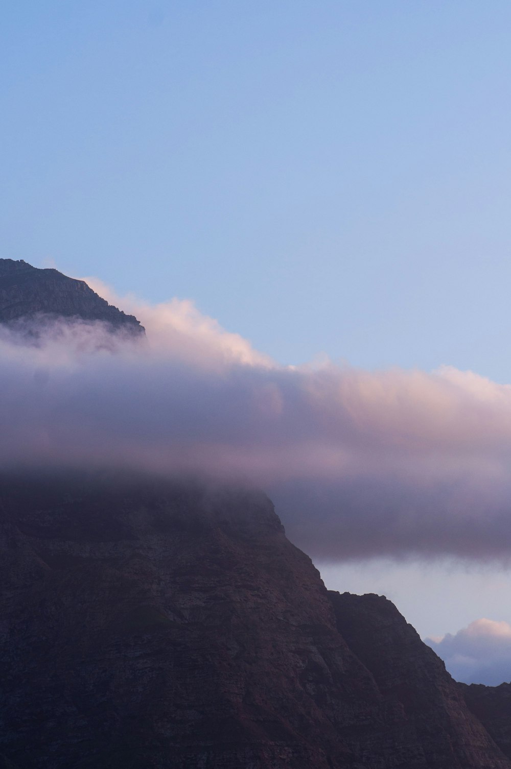 a mountain with clouds