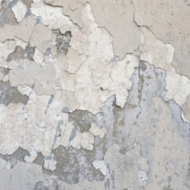 a white wall with cracks