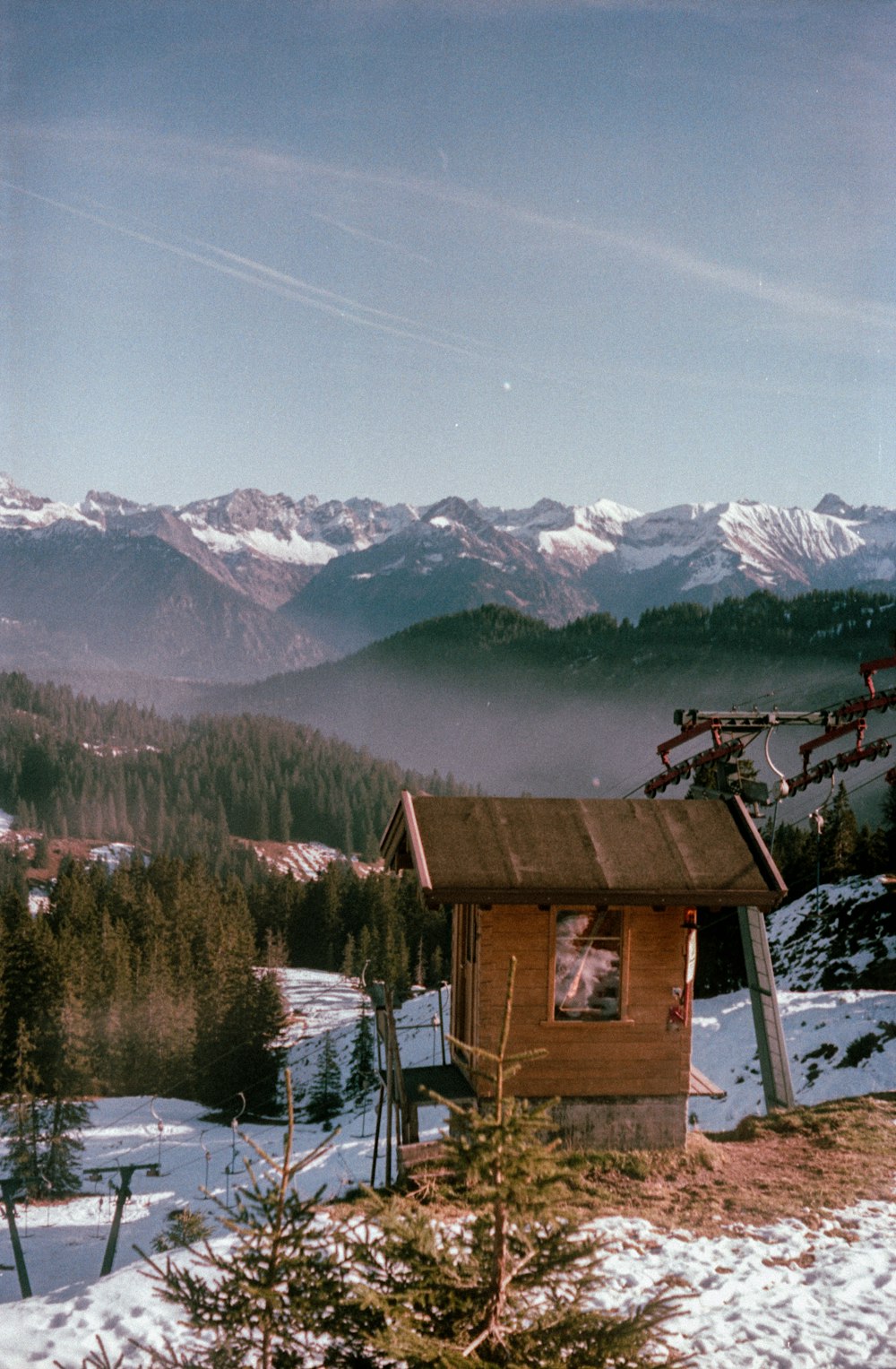 a cabin in a snowy landscape