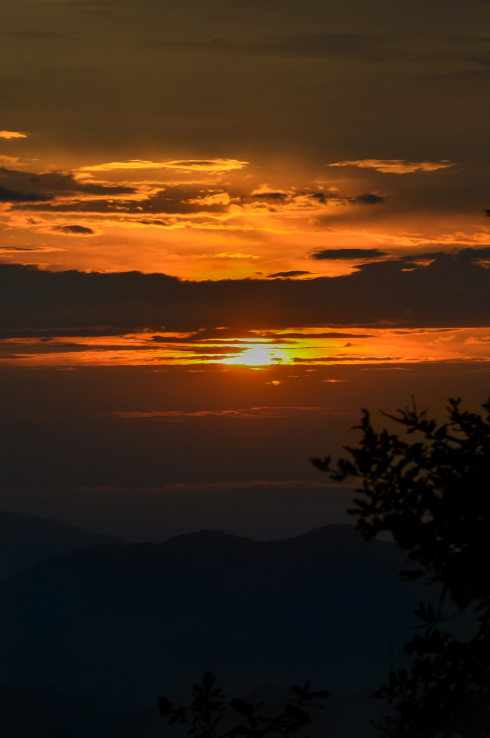 a sunset over a mountain range