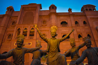 a group of statues in front of a building