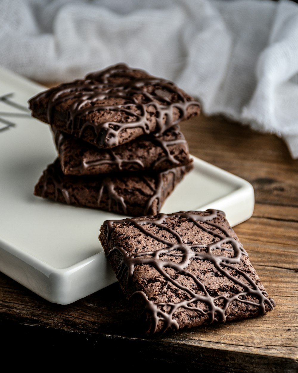 a couple of chocolate cupcakes on a plate