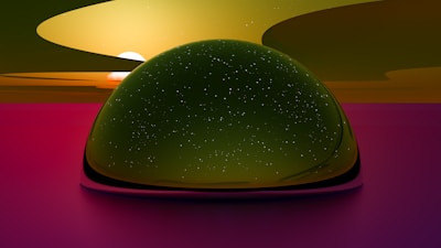 A large, dome-like structure with a reflective surface appears in the center, resembling a starry sky. The background features a vibrant sunset with shades of orange, yellow, and pink merging seamlessly. There is a serene and surreal atmosphere created by the soft blending of colors and celestial elements.