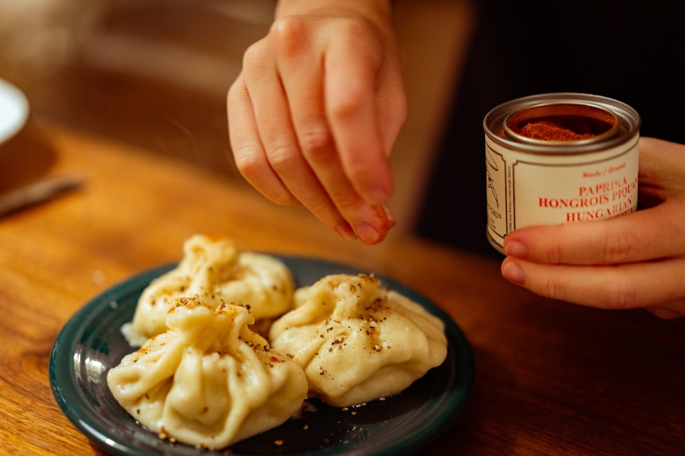 a plate of food and a can of sauce