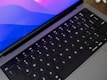 A close-up of hands typing on a sleek keyboard.