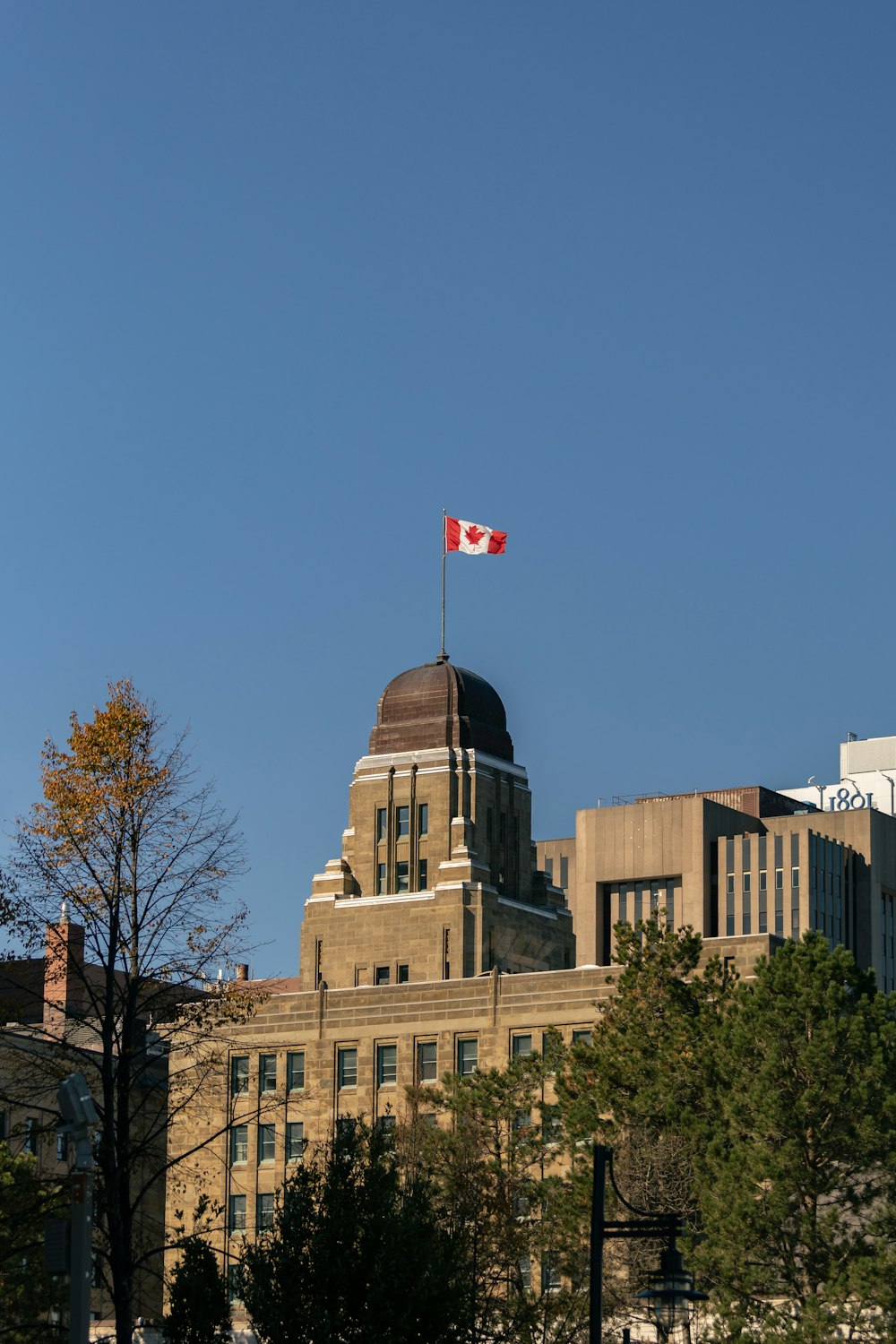 a flag flying on top of a building