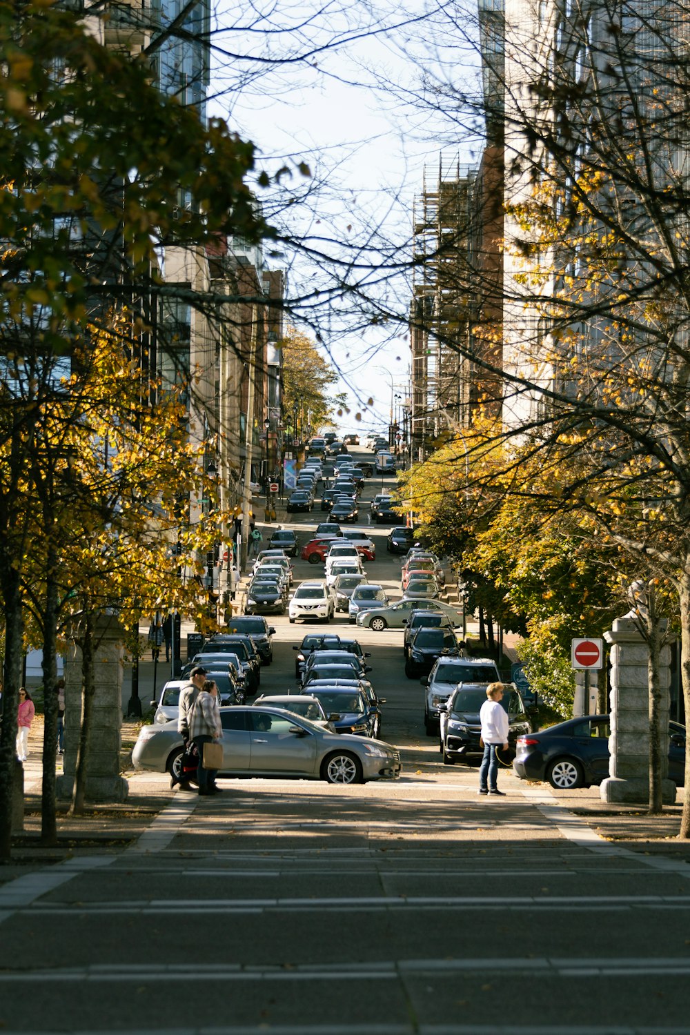 a busy street with cars and people