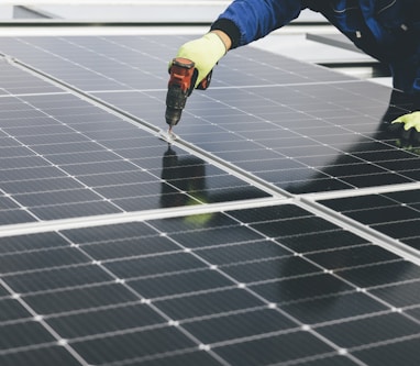 a person working on a solar panel