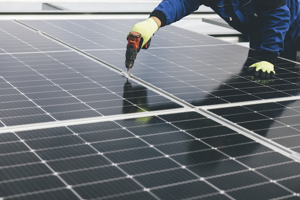 a person working on a solar panel