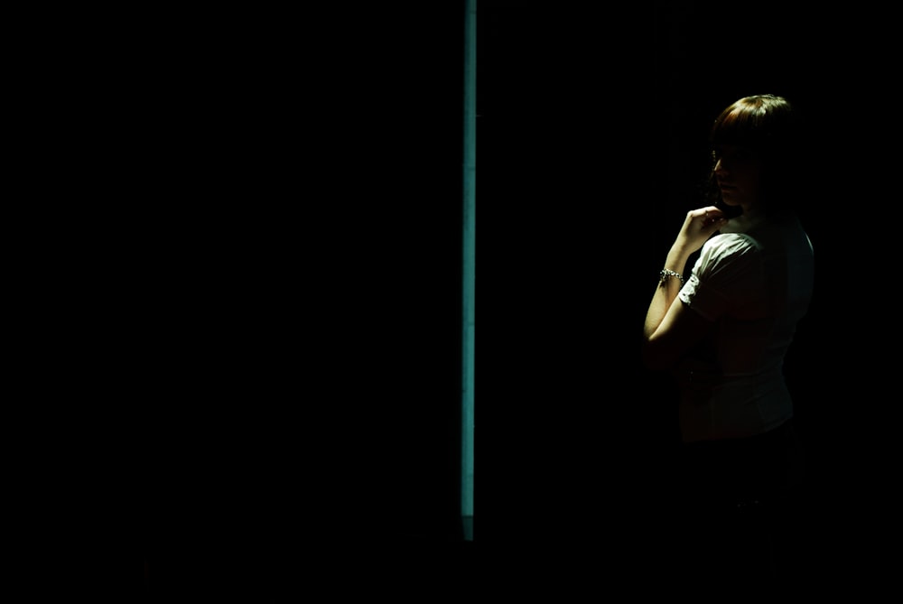 a person standing in a dark room