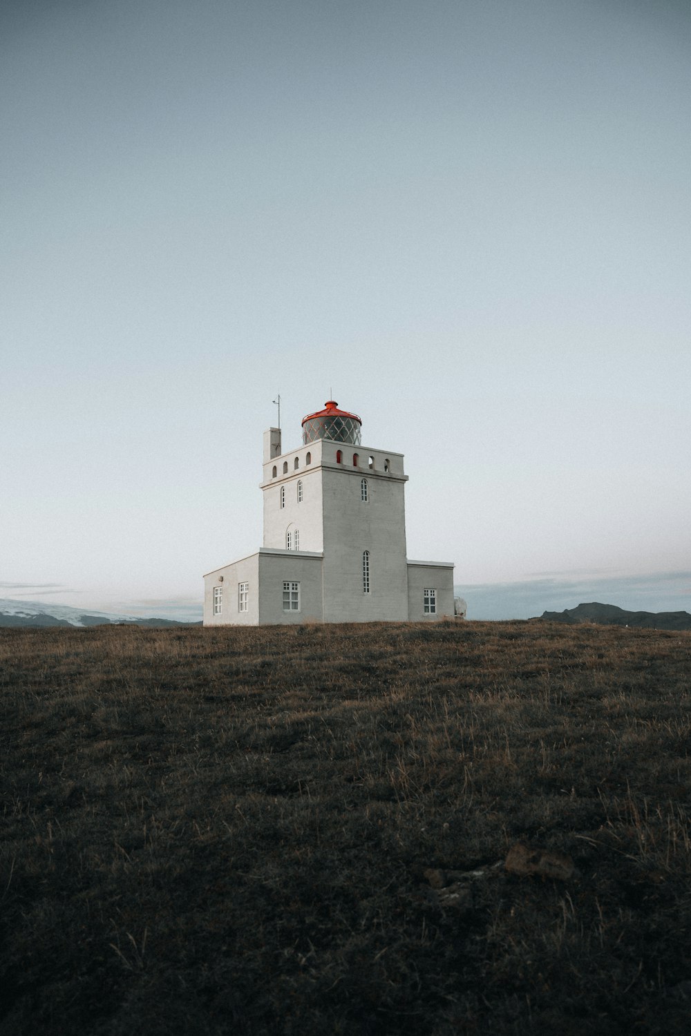 a lighthouse on a hill