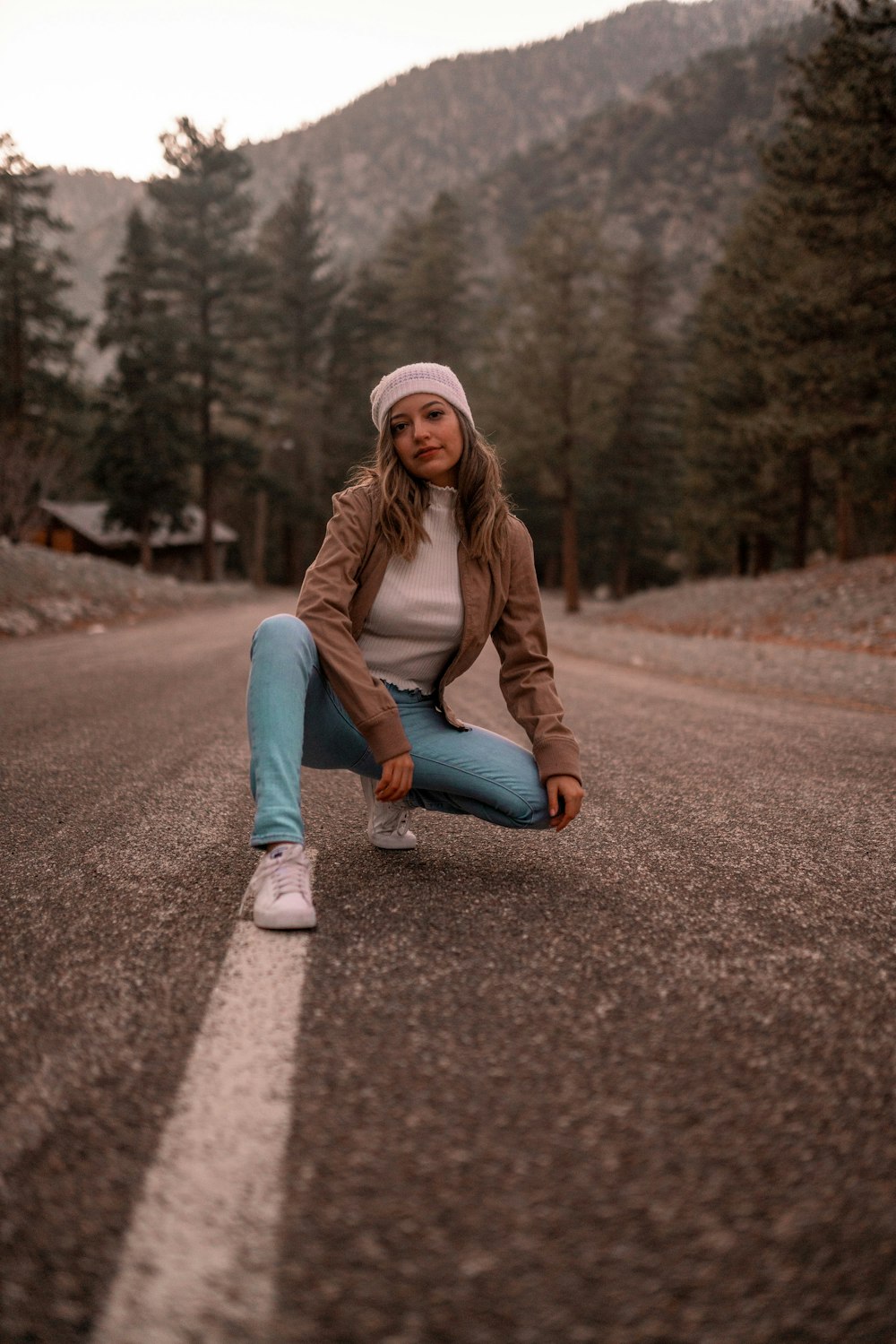 a person sitting on a road