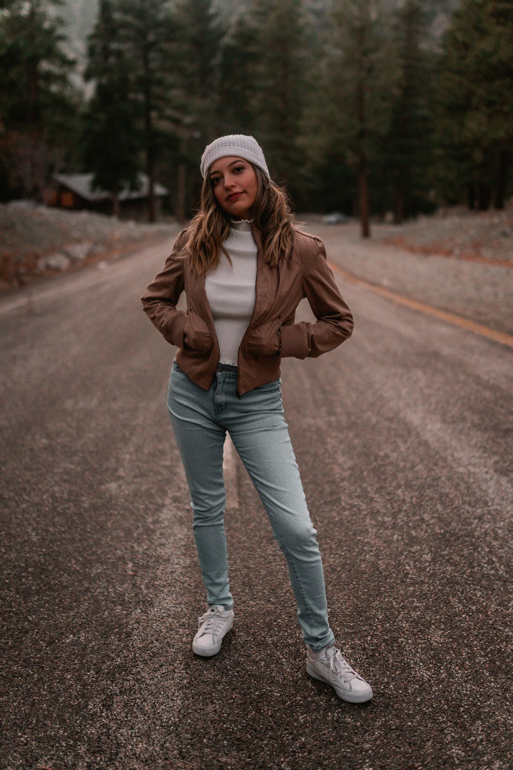 a woman standing on a road