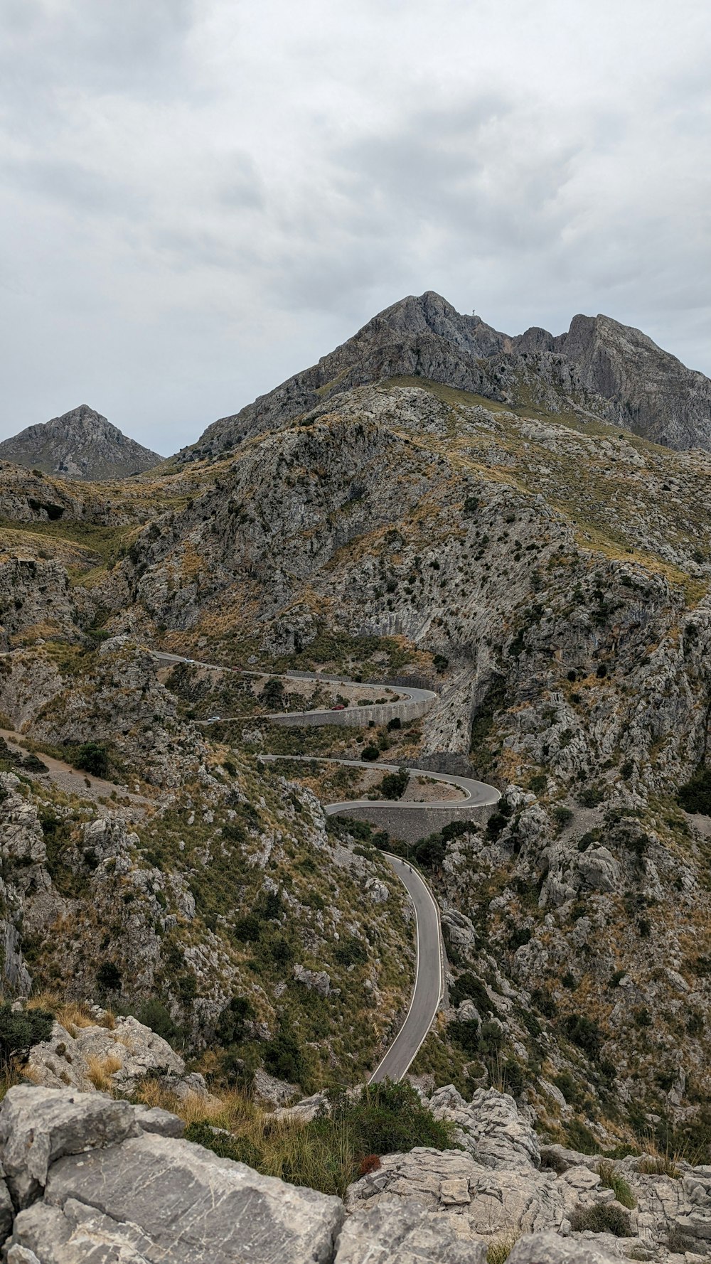 a road going through a rocky mountain